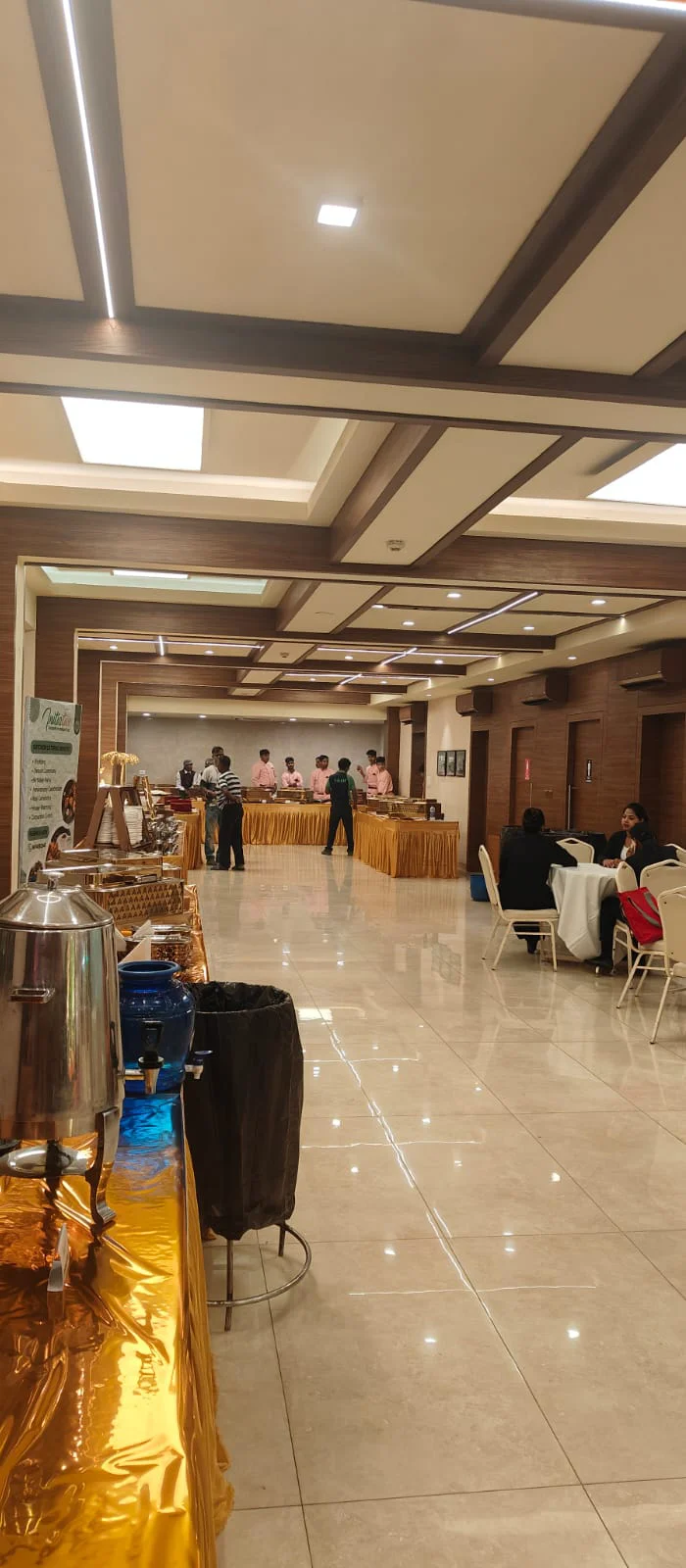 Banquet hall setup with dining tables for catering event