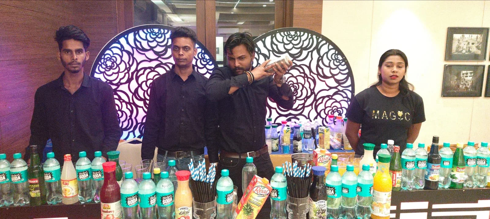 Catering staff at welcome drinks counter with beverages