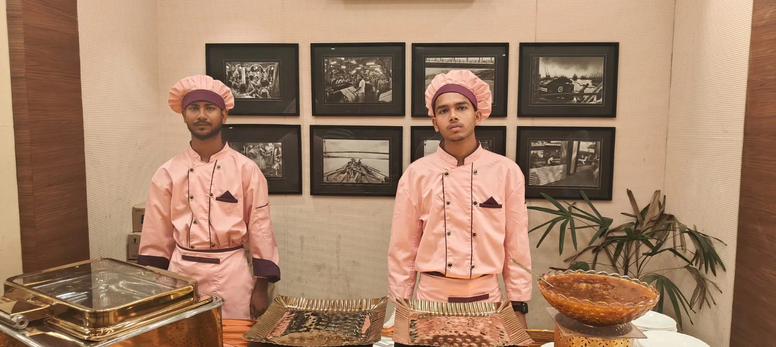 Catering staff in traditional pink turbans at event